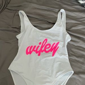 Brand new, never worn. White one piece bathing suit bride.